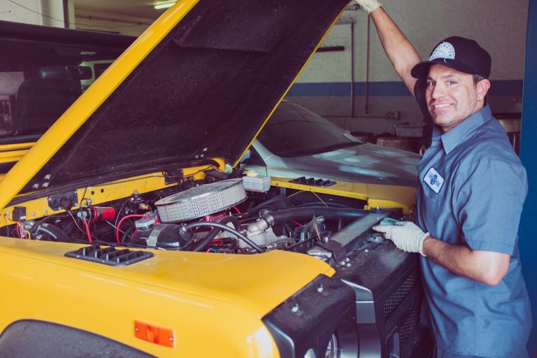 Vehicle being checked in a garage, representing RTA inspection and car movement service in Dubai